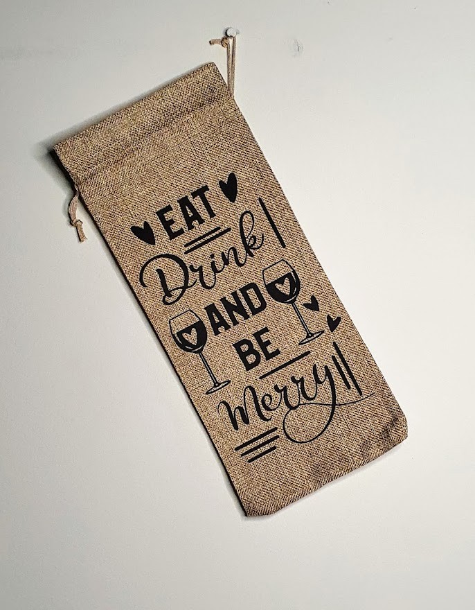 Personalised Hessian Wine Bag with Black coloured text that says"Eat, Drink and Be Merry!".
